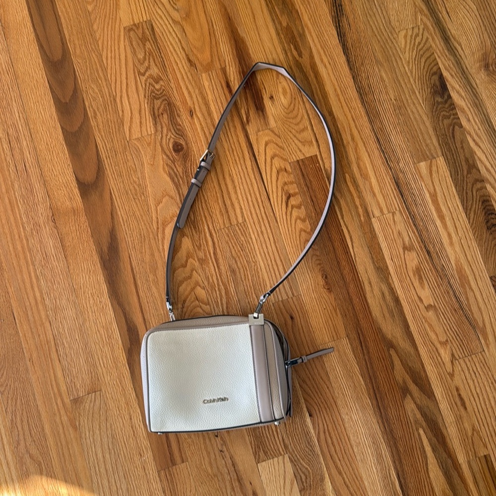 Calvin Klein taupe and white cross body bag
